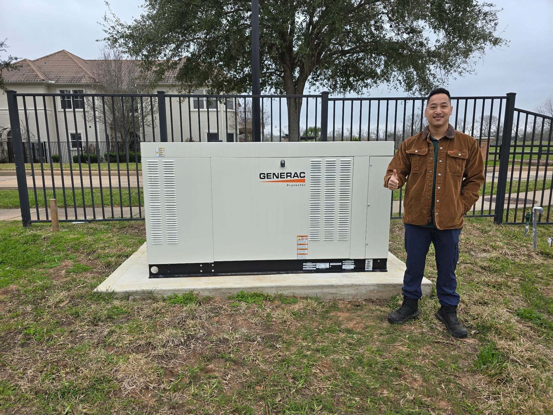 A completed Generac liquid-cooled standby generator installed on a poured concrete pad by Critical Power Solutions
