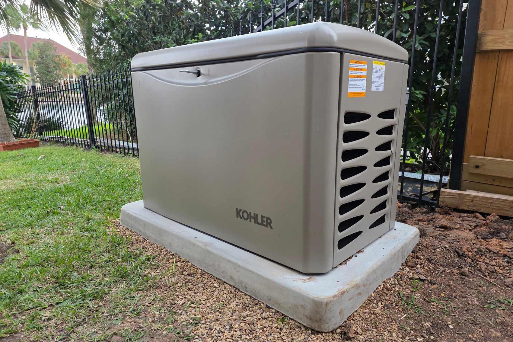 A Kohler standby generator installed and commissioned by Critical Power Solutions on a concrete pad