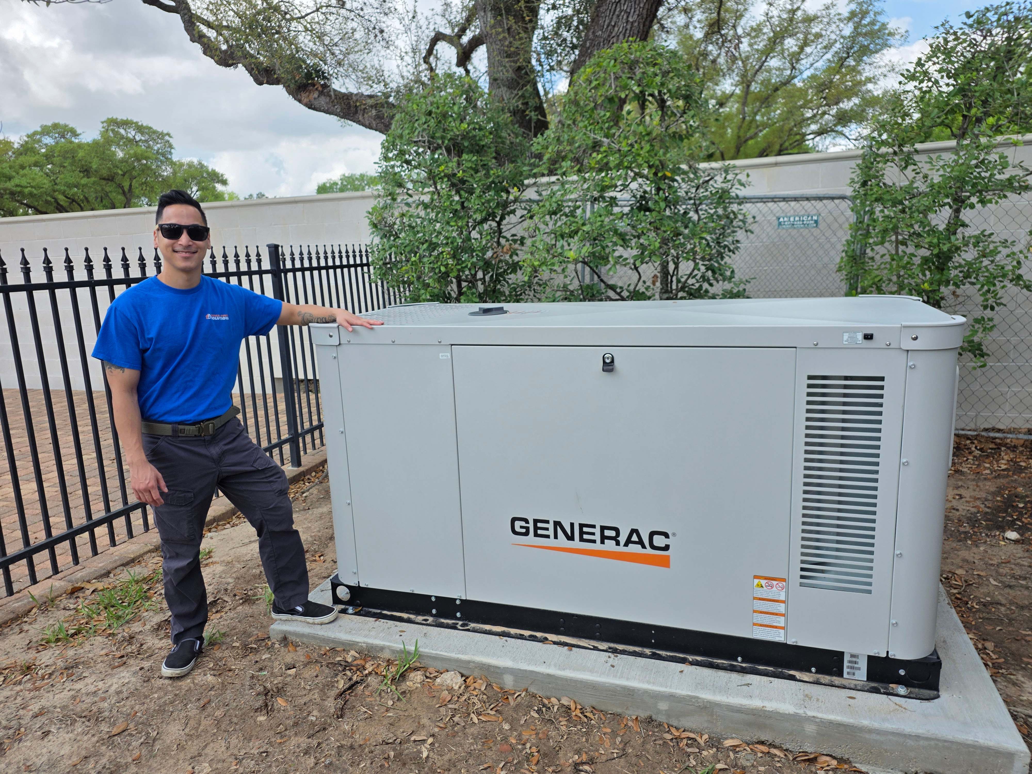 A Critical Power Solutions technician standing beside a large liquid-cooled Generac standby generator on its concrete pad
